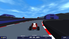 PolyTrack gameplay showing a red race car speeding around a paved circuit corner